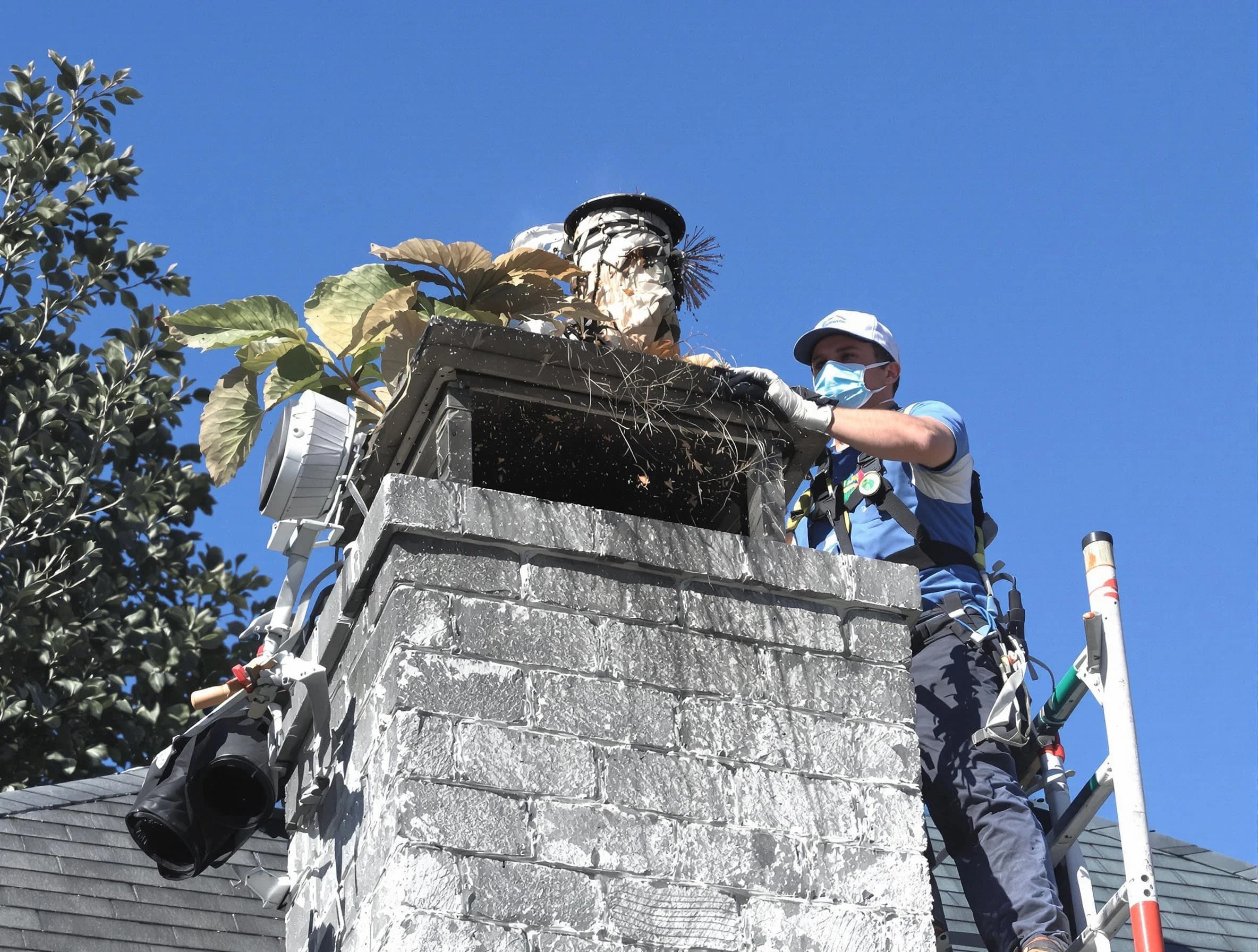 Phoenix Chimney Sweep specialist performing chimney cleaning in Phoenix, AZ
