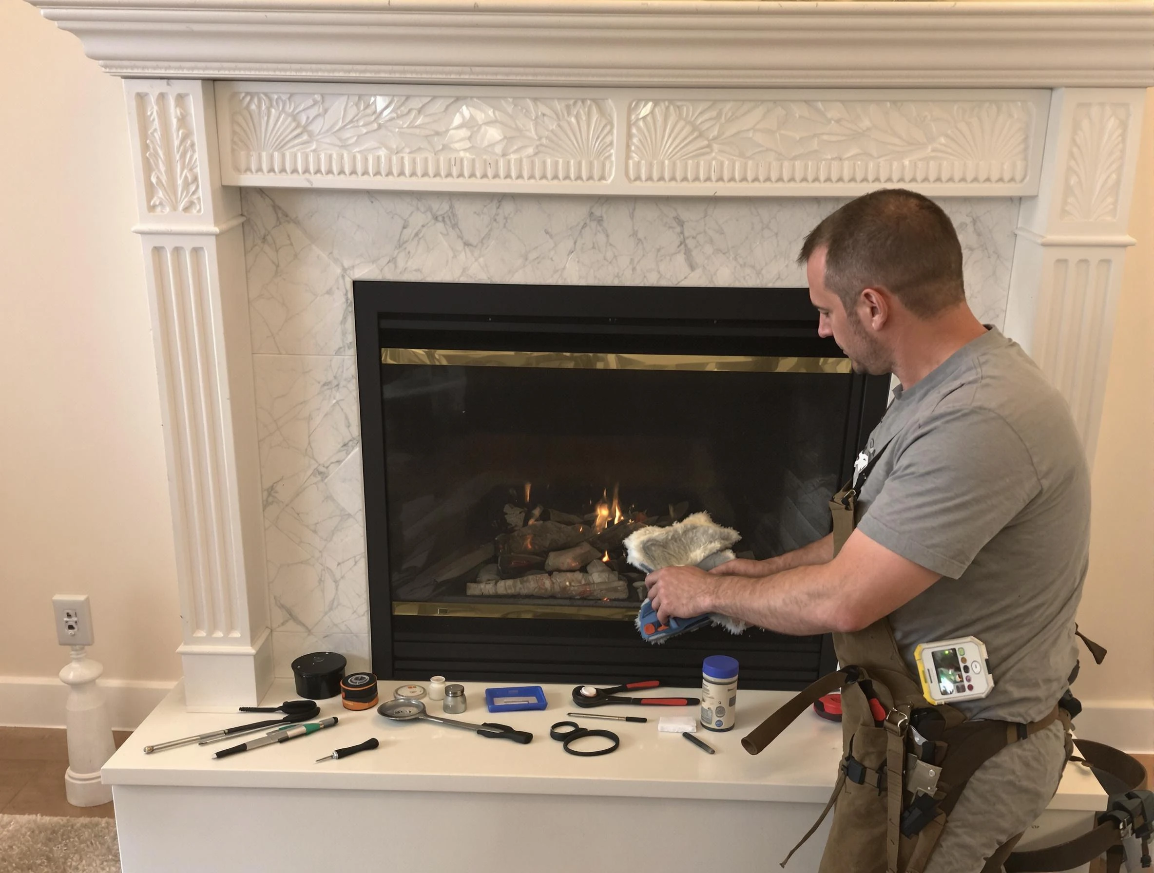Phoenix Chimney Sweep performing fireplace maintenance in Phoenix, AZ